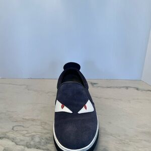 Fendi Monster suede slip on shoes for men in blue color.
